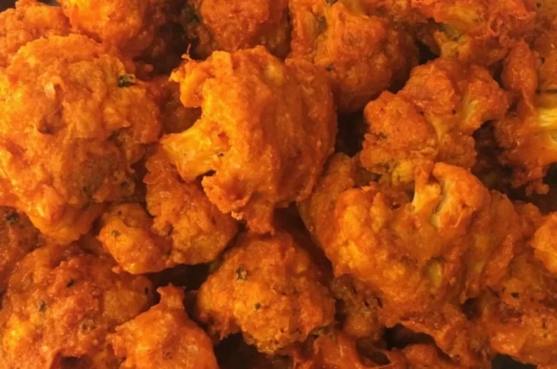 Crispy baked buffalo cauliflower wings served with dipping sauce