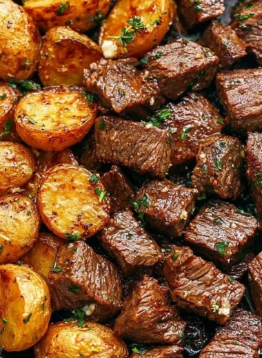 Garlic butter steak bites served with roasted potatoes