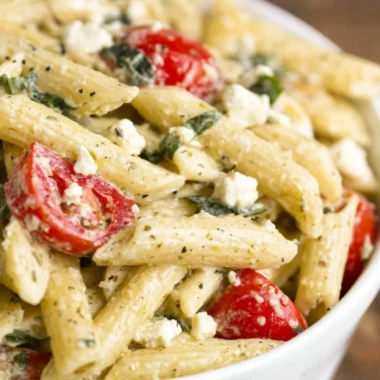 Bowl of Greek Pasta Salad with colorful veggies and feta cheese