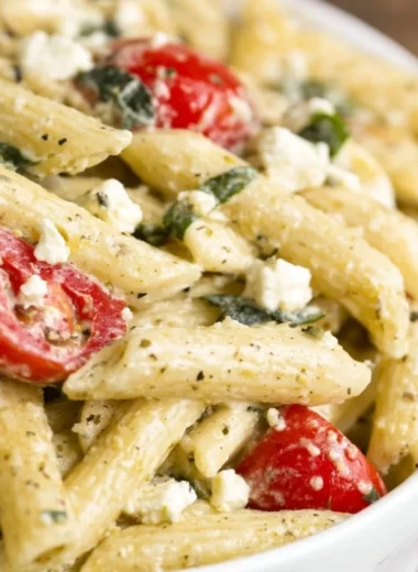 Bowl of Greek Pasta Salad with colorful veggies and feta cheese
