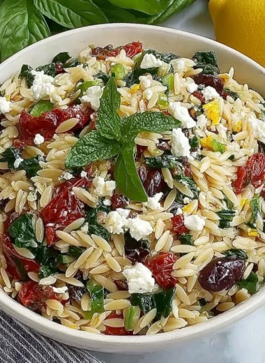 Delicious homemade orzo pasta salad with feta cheese and sun-dried tomatoes