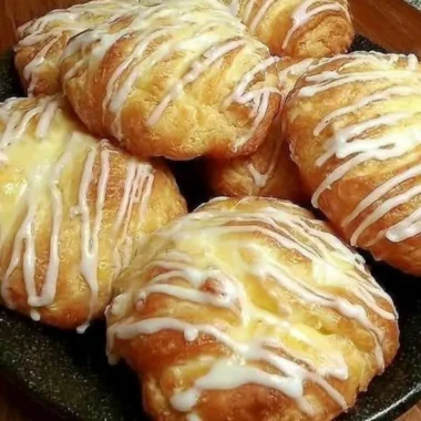 Freshly baked individual cream cheese danish with creamy filling