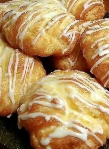 Freshly baked individual cream cheese danish with creamy filling