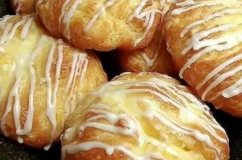 Freshly baked individual cream cheese danish with creamy filling
