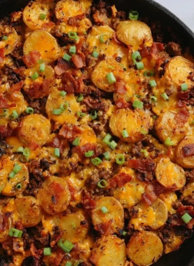 Loaded Ground Beef and Potatoes Skillet cooking in a pan