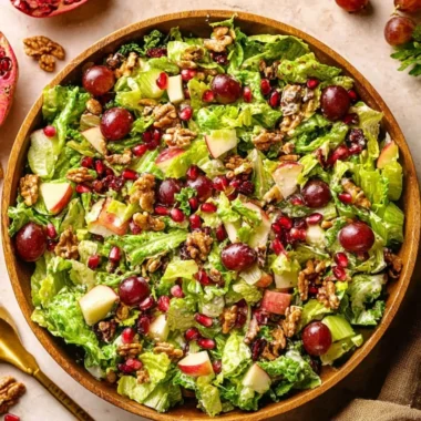 Bowl of modern Waldorf salad with apples, walnuts, and grapes
