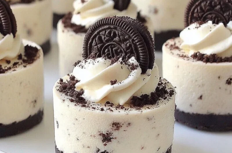 Delicious no-bake Oreo cheesecakes topped with crushed Oreos.