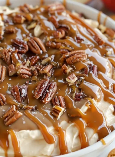 Delicious salted caramel pecan cheesecake dip served in a bowl with toppings