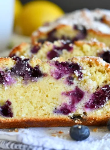 Soft and moist lemon blueberry yogurt cake served on a plate