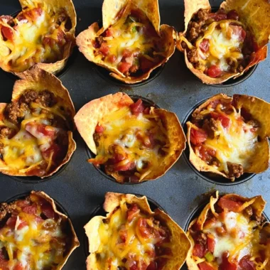 Delicious Taco Muffins served on a platter with fresh toppings.
