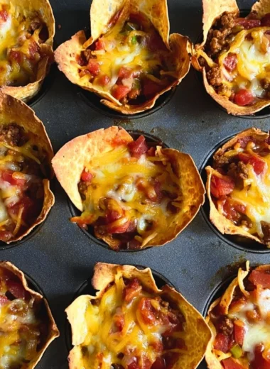 Delicious Taco Muffins served on a platter with fresh toppings.