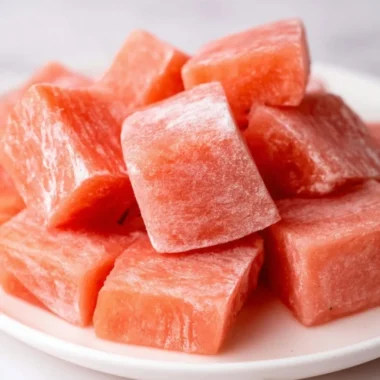 Delicious watermelon mochi served on a plate, showcasing its vibrant color and texture