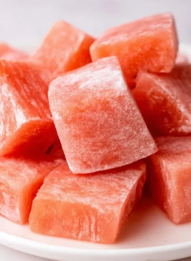 Delicious watermelon mochi served on a plate, showcasing its vibrant color and texture